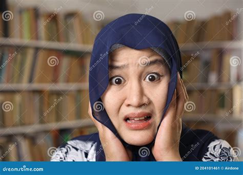 Asian Muslim Woman Wearing Hijab Shocked With Mouth Opened Afraid