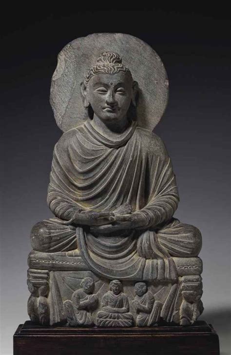 A Gray schist Figure of a Seated Buddha Gandhara, 2nd/3rd century 15 ¾ ...