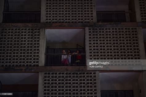 Women Look From An Aparment Building During A Power Cut In Caracas On News Photo Getty Images