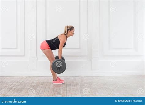 Side View Concentration Portrait Of Young Athletic Beautiful