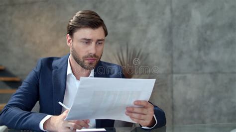 Focused Businessman Working With Documents In Office Business Man