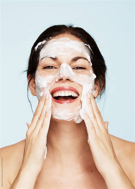 Beautiful Brunette Woman Cleaning Her Face With Soap By Stocksy Contributor Leandro Crespi