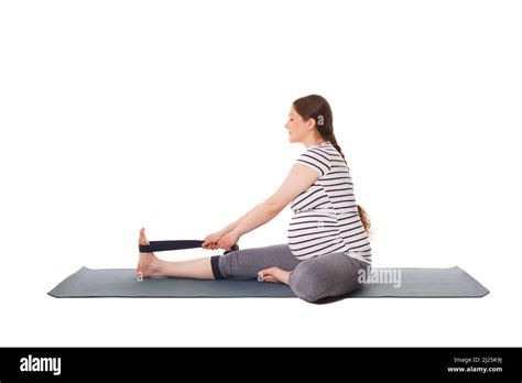 Pregnant Woman Doing Yoga Asana Janu Sirsasana A Stock Photo Alamy