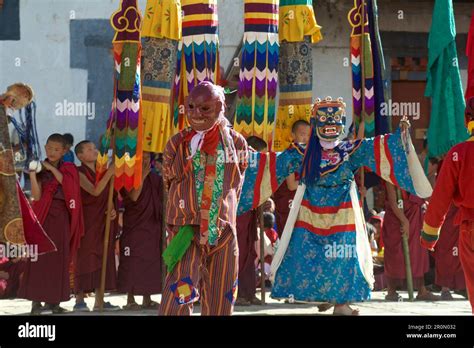 Masked Dancers And Monks At Mask Dance Feast At Gangteng Monastery Phobjikha Valley Bhutan