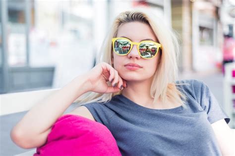 Premium Photo Portrait Of Young Woman Wearing Sunglasses