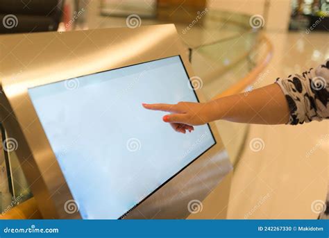 Woman Using Interactive Touchscreen Display At Urban Exhibition