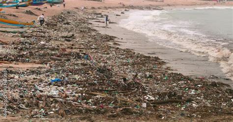 Man Is Walking Along The Worlds Most Polluted Beach In Bali Plastic