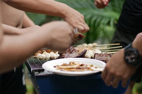 Premium Photo Cropped Hands Of People Eating Food