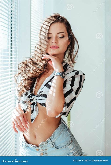 Beautiful Brunette Woman With Natural Hair In Sensual Pose On Bed With Open Stock Image Image