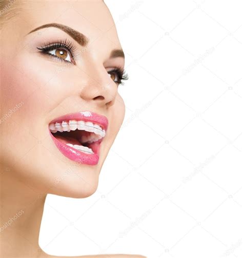 Woman smiling with braces on teeth — Stock Photo © Subbotina #80042240