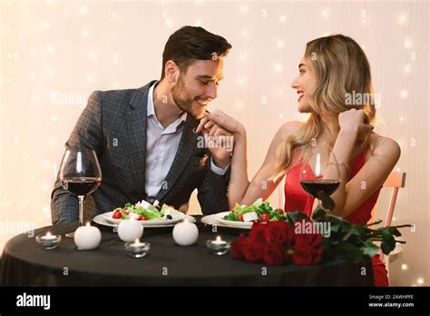 Romantic Beautiful Couple Dining In Restaurant Loving Man Kissing