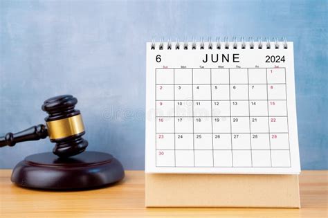 Desk Calendar For June And Judge S Gavel On The Table Stock Photo