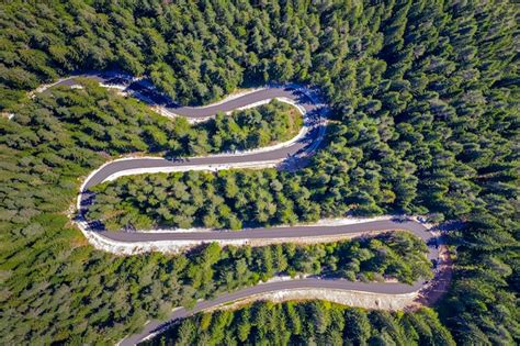 Premium Photo | Aerial view from drone of curves of mountain road ...