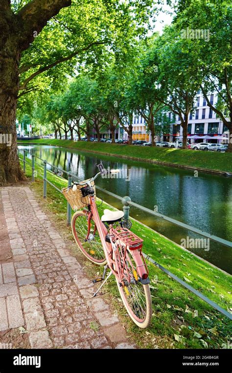 Pink Vintage Bike At The City Canal Of The Famous Shopping Boulevard