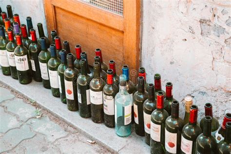 Empty Wine Bottles Sitting In A Wood Stand Editorial Stock Image