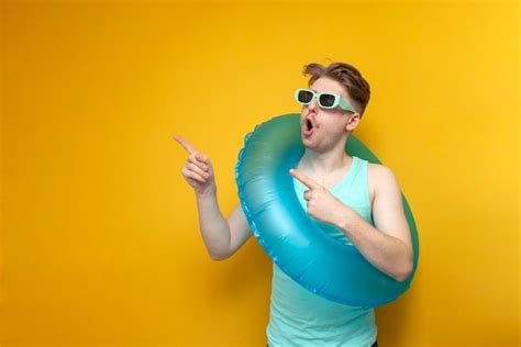 Premium Photo Young Guy In Sunglasses And With An Inflatable Swim