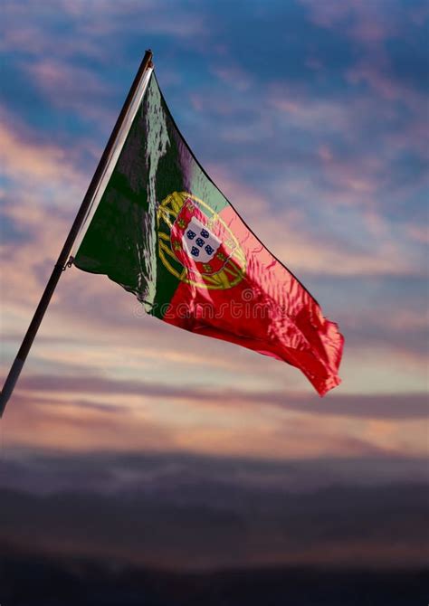 Portugal Flag Portuguese Flag Waving On Sky At Dusk Stock Photo