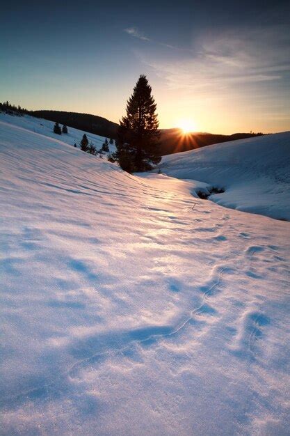 Premium Photo Sunset Over Snowy Mountains