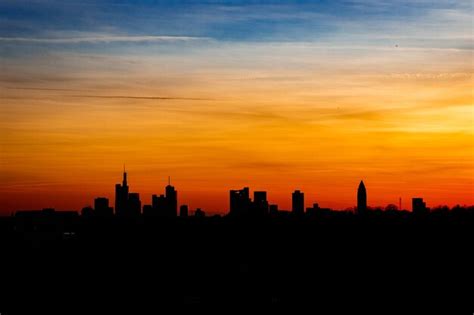 Premium Photo Silhouette Of Buildings At Sunset