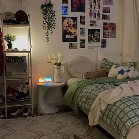 A Bed Room With A Neatly Made Bed And Pictures On The Wall