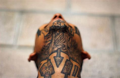 guardian: El Salvador: A member of the Mara 18 street gang poses for a ...