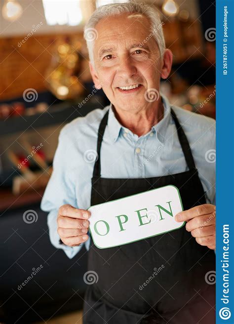 Welcome Weve Been Waiting For You Portrait Of A Senior Man Holding Up