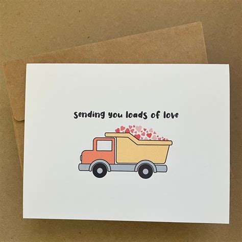 A Card With A Dump Truck And Hearts In The Back Saying Sending You