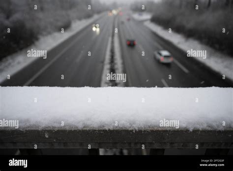 08 March 2023, Hesse, Gießen: Snow lies on a railing above the A485. An official warning of ...