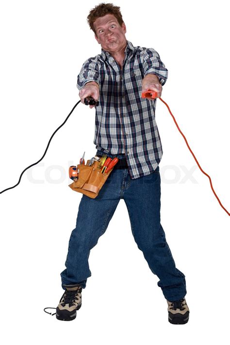 Man getting an electric shock from jump leads | Stock image | Colourbox