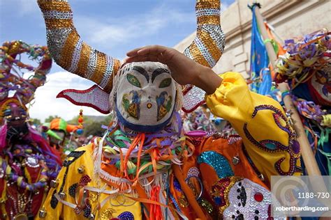 Revellers in costumes and masks at Humahuaca carnival in Jujuy province ...