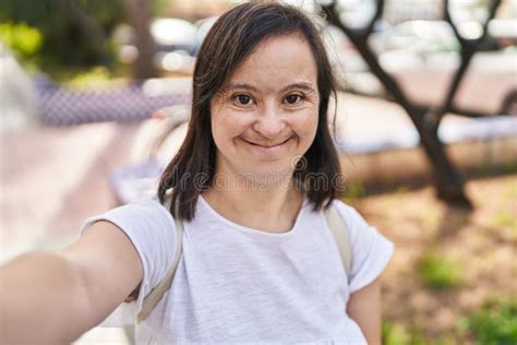 Down Syndrome Woman Smiling Confident Making Selfie By The Camera At