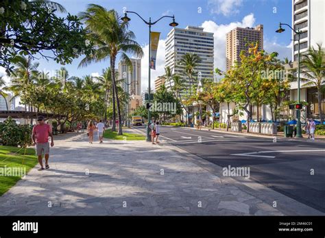 Kalakaua Avenue A Busy Shopping Street Alongside Waikiki Beach In