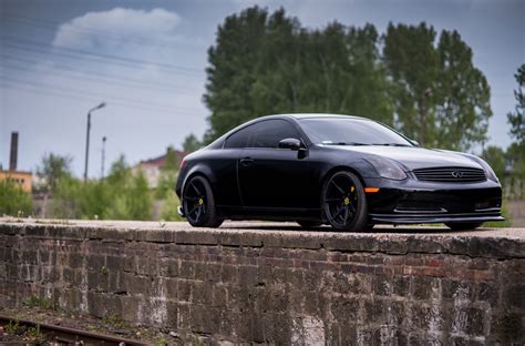 Showy Black Infiniti G35 on JR Rims with Yellow Brakes | CARiD.com Gallery