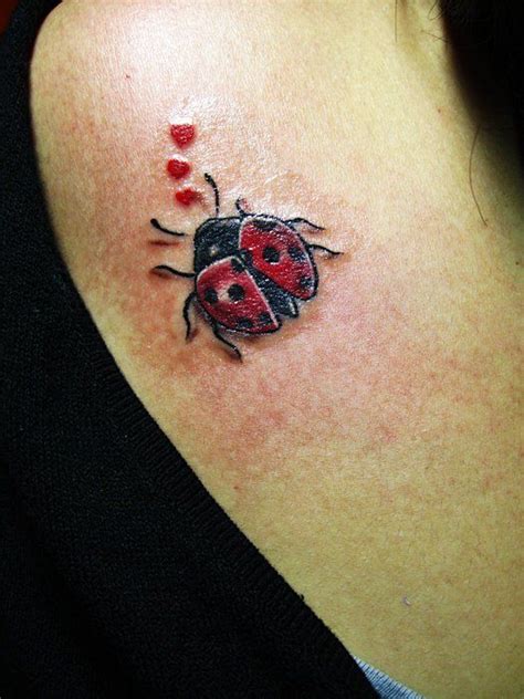 My First Ever Tattoo A Lady Bug And Three Hearts Lady Bug Tattoo