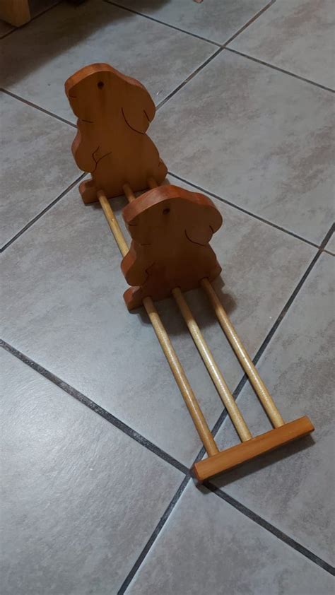 Wooden Rabbits With One Sliding On The 3 Wooden Rails Rwhatisthis