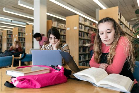 "Students In A College Library" by Stocksy Contributor "Sean Locke ...