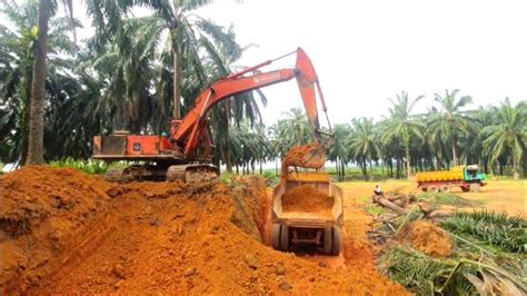 Excavator Dump Truck Digging Limestone On Road Construction Kobelco