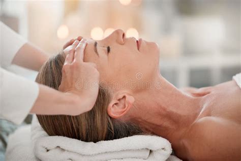 The Mind Holds So Much Tension A Woman Receiving A Facial Massage