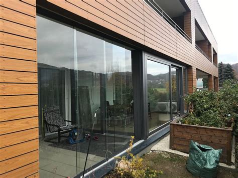 Terrassenverglasung mit glasschiebewand und hebeschiebetüre von