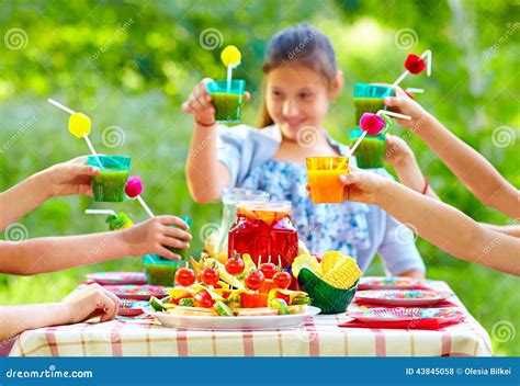 Colorful Picnic Table With Group Of Kids Around Stock Photo Image Of