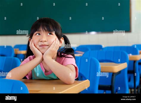 Asian Student Girl Child Kid School Classroom Think Look Hi Res Stock