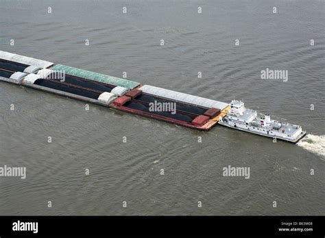 Coal barge pushes up Mississippi river at St Louis Missouri Stock Photo ...