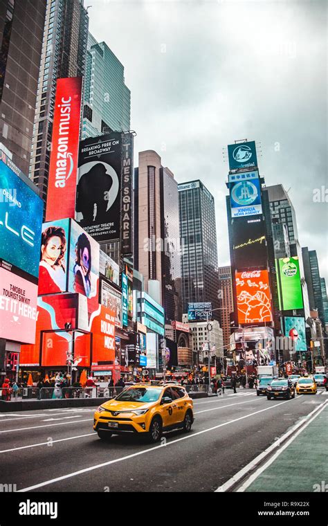 New York City: Typical street scene in Times Square, NYC, with yellow ...