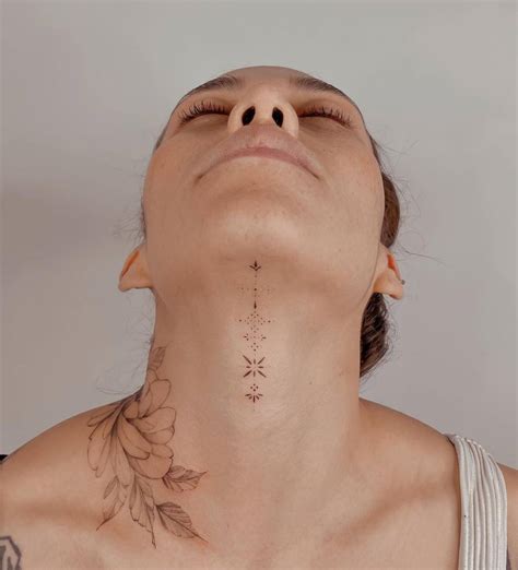 Fine Line Style Ornament Tattoo Placed On The Throat