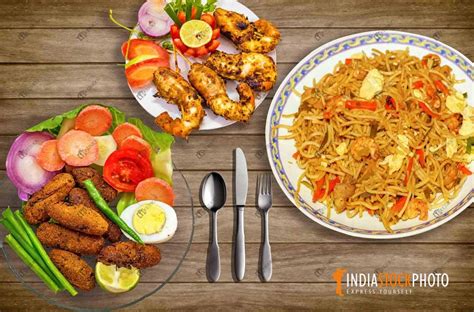 Spicy Indian Food Of Hakka Noodles With Crispy Prawn And Fish Fingers ...