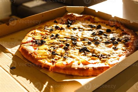 Fresh Pizza In Cardboard Box On Wooden Table Closeup 20889026 Stock