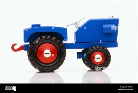 Blue toy tractor Stock Photo - Alamy