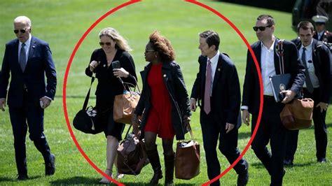 Biden Flanked By Aides On Walks Across White House Lawn To Block