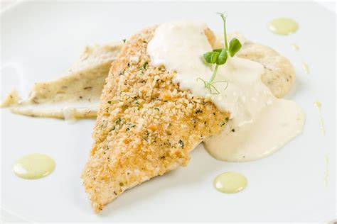 Panko Herb Crusted Baked Fish Recipe With Creamy Garlic White Sauce Is