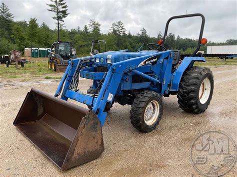 NEW HOLLAND TC30 4X4 TRACTOR W LOADER Jeff Martin Auctioneers Inc